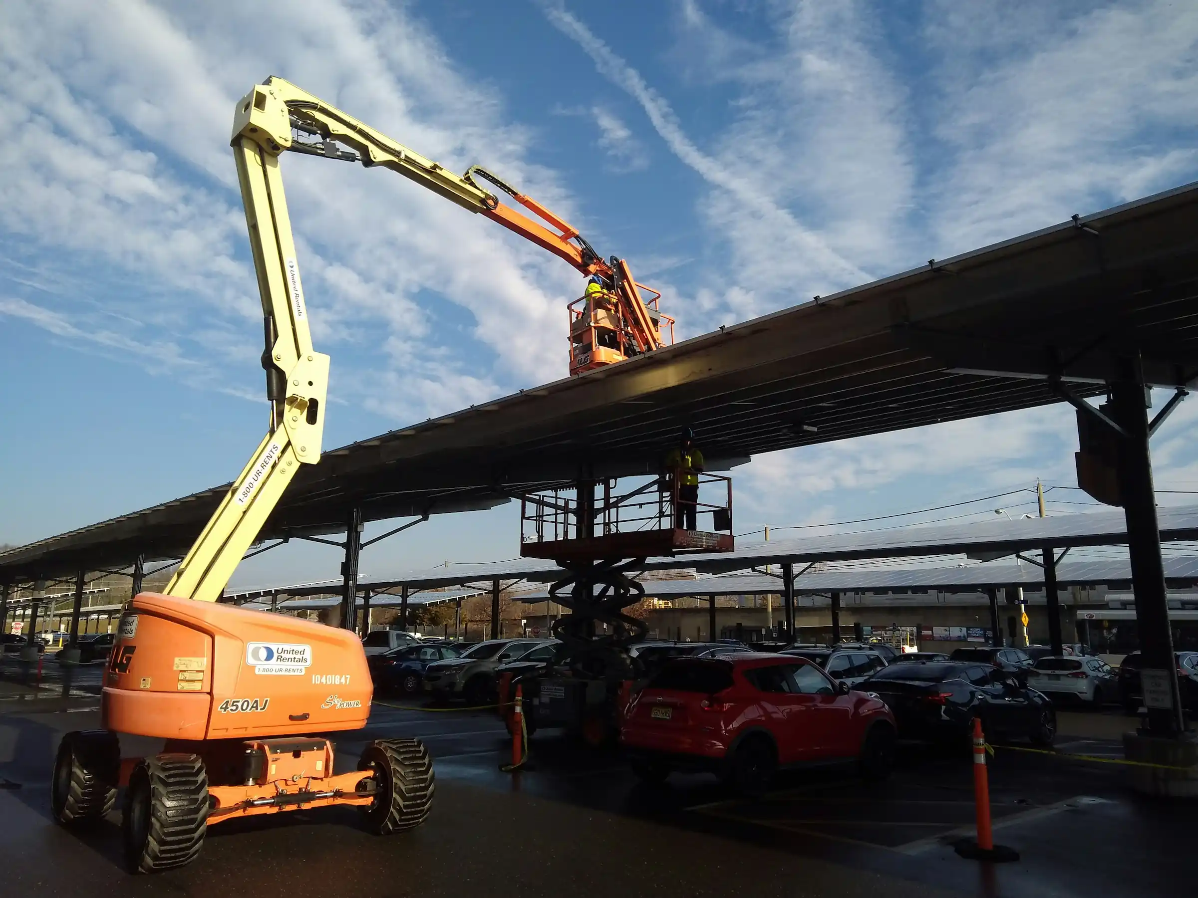 Boom lift equipment against the sky